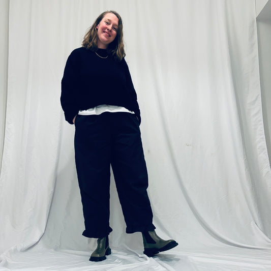 Navy barrel-leg trousers with frill