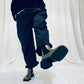 Navy barrel-leg trousers with frill