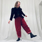 Red barrel-leg trousers with pink zig zags