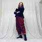Red barrel-leg trousers with pink zig zags
