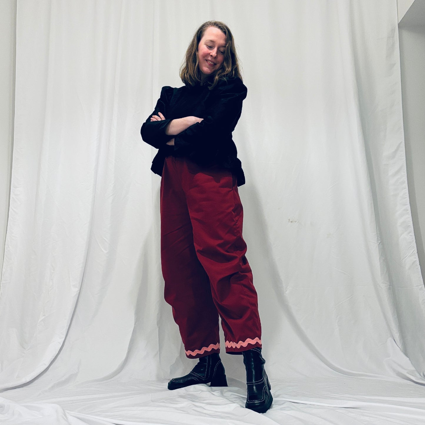 Red barrel-leg trousers with pink zig zags