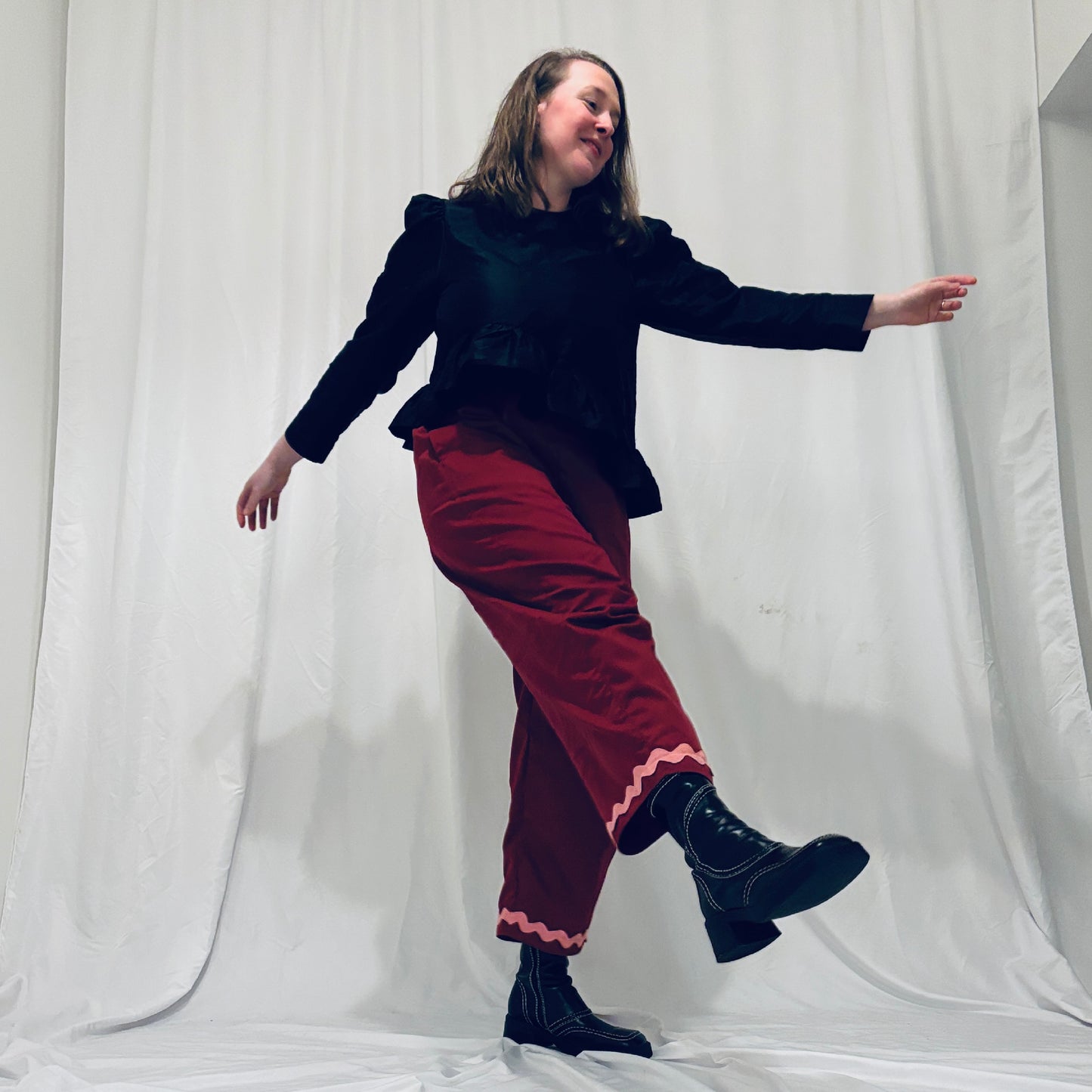 Red barrel-leg trousers with pink zig zags