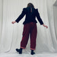 Red barrel-leg trousers with pink zig zags