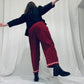 Red barrel-leg trousers with pink zig zags