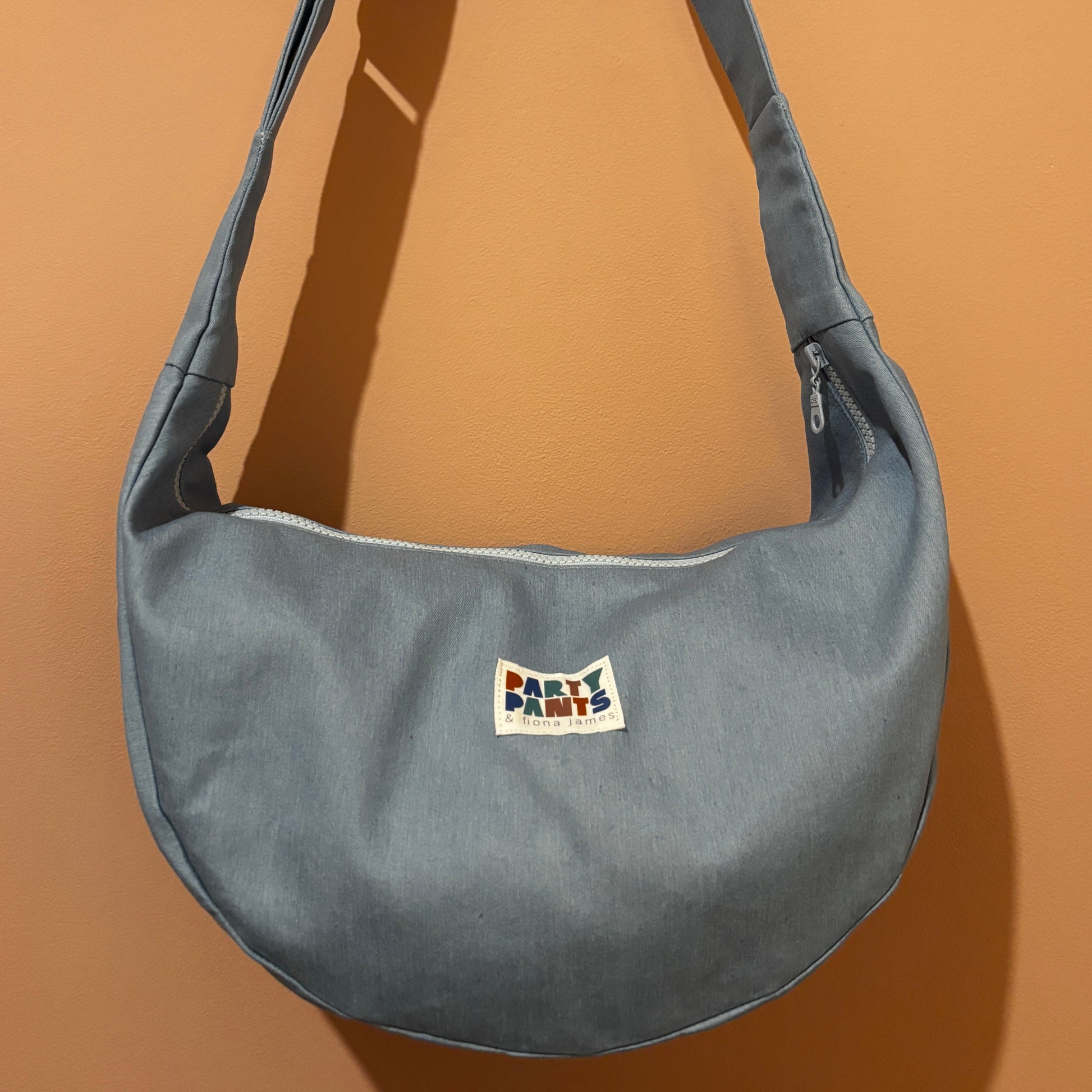 Light blue denim moon bag