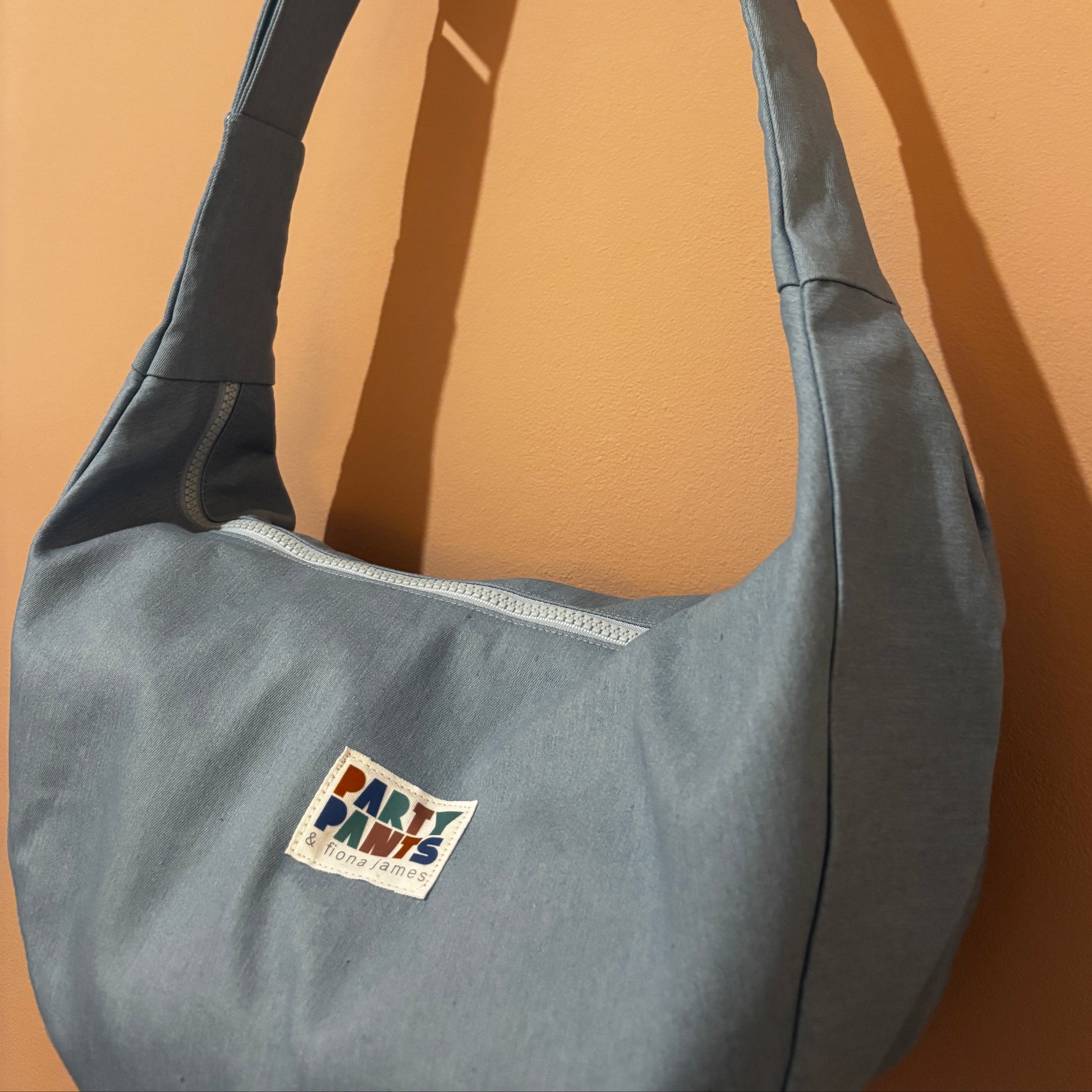 Light blue denim moon bag