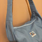 Light blue denim moon bag