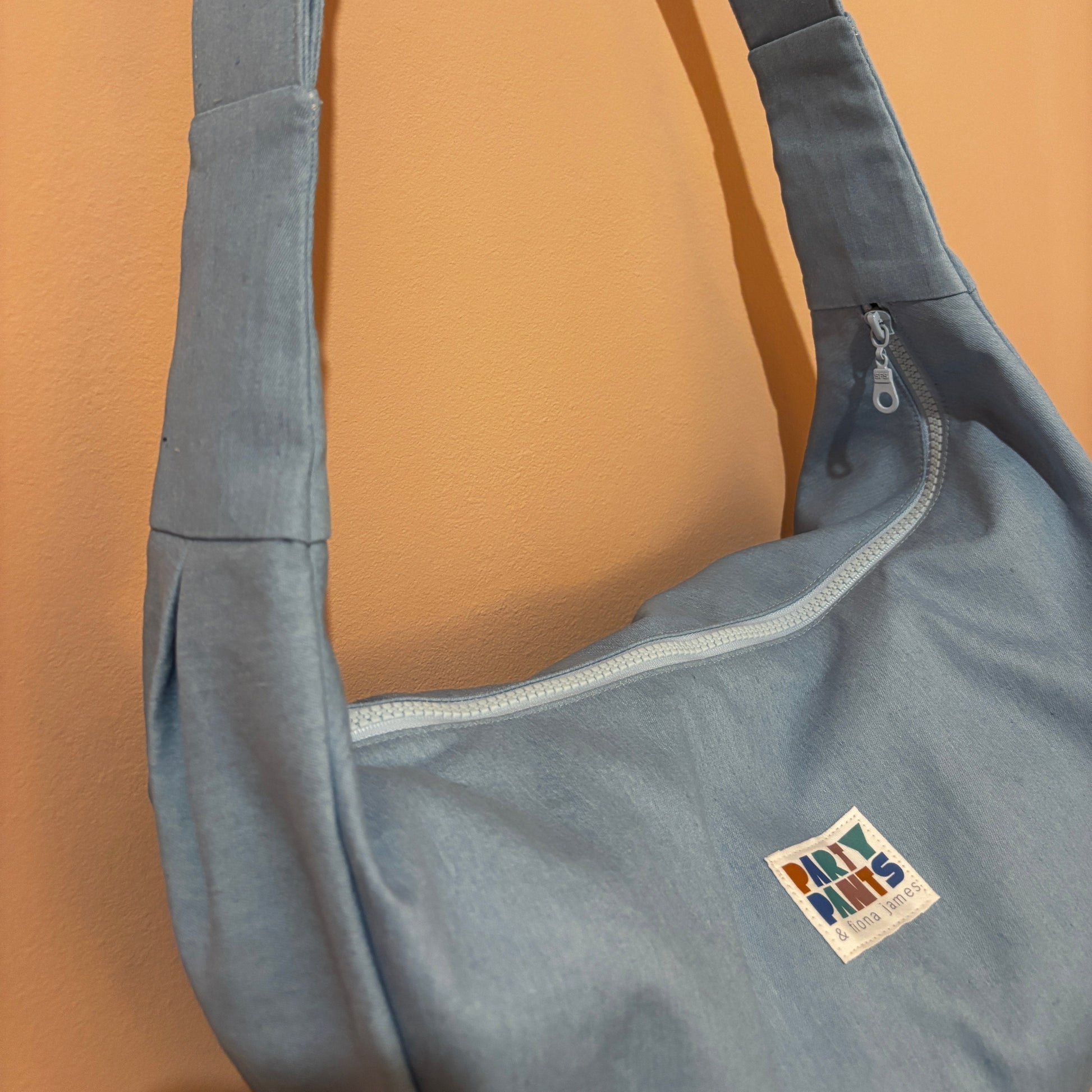 Light blue denim moon bag