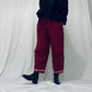 Red barrel-leg trousers with pink zig zags
