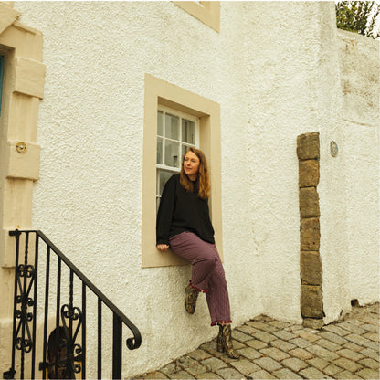 Stripe trousers with pom poms